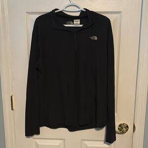 The North Face Men’s Size XL all black 1/4 zip top. No damages.